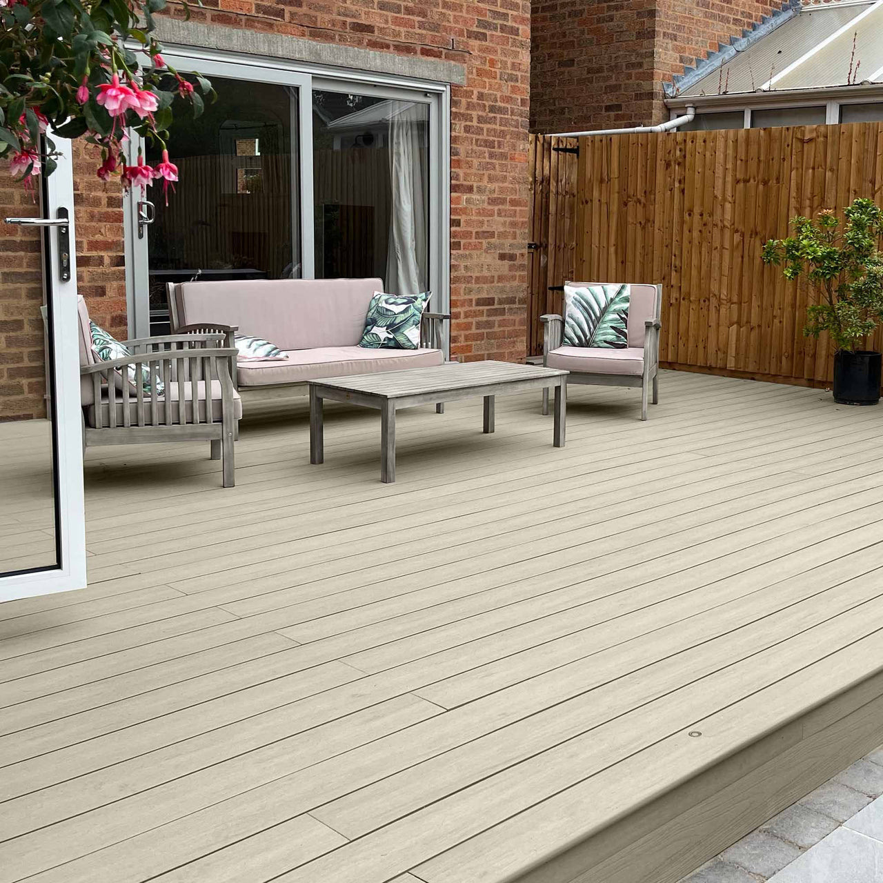 Patio area with composite deck and outdoor furniture set.